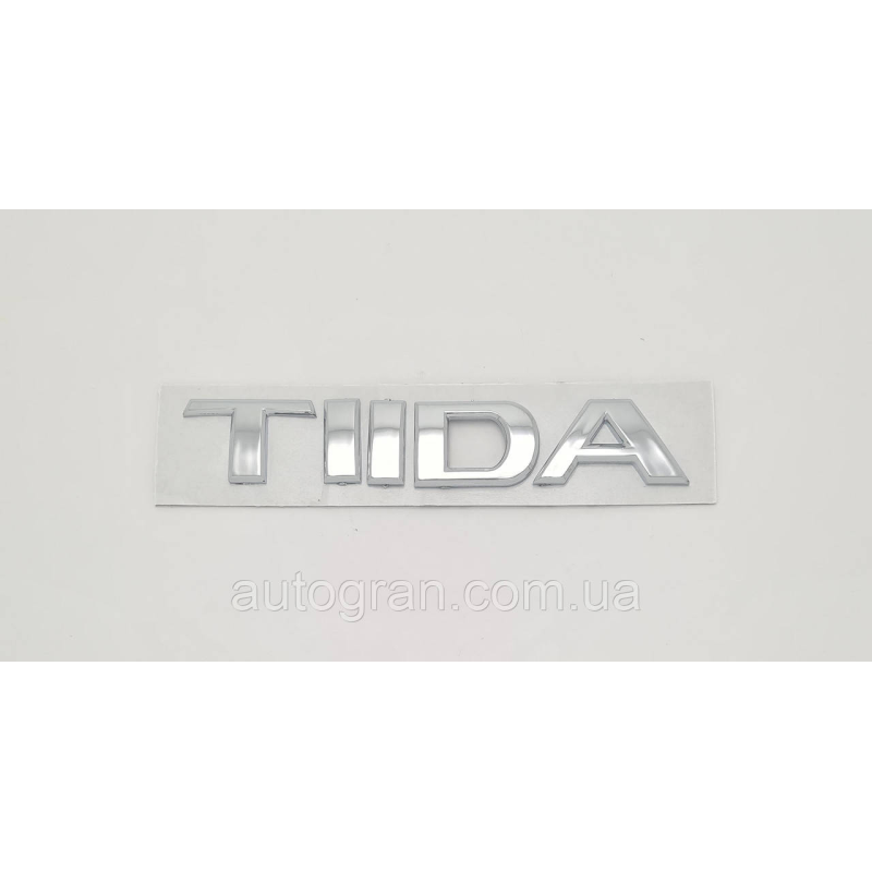 Емблема напис багажника Nissan Tiida